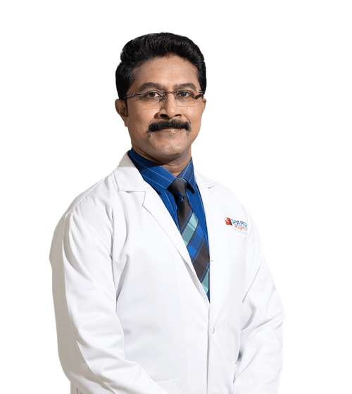 Dr. Roopesh N, gynecologic onco-surgeon, in a white coat